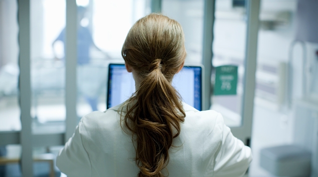 Healthcare worker looking at screen