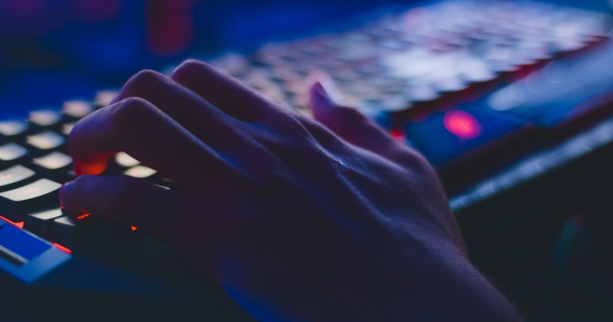 A hand on a keyboard