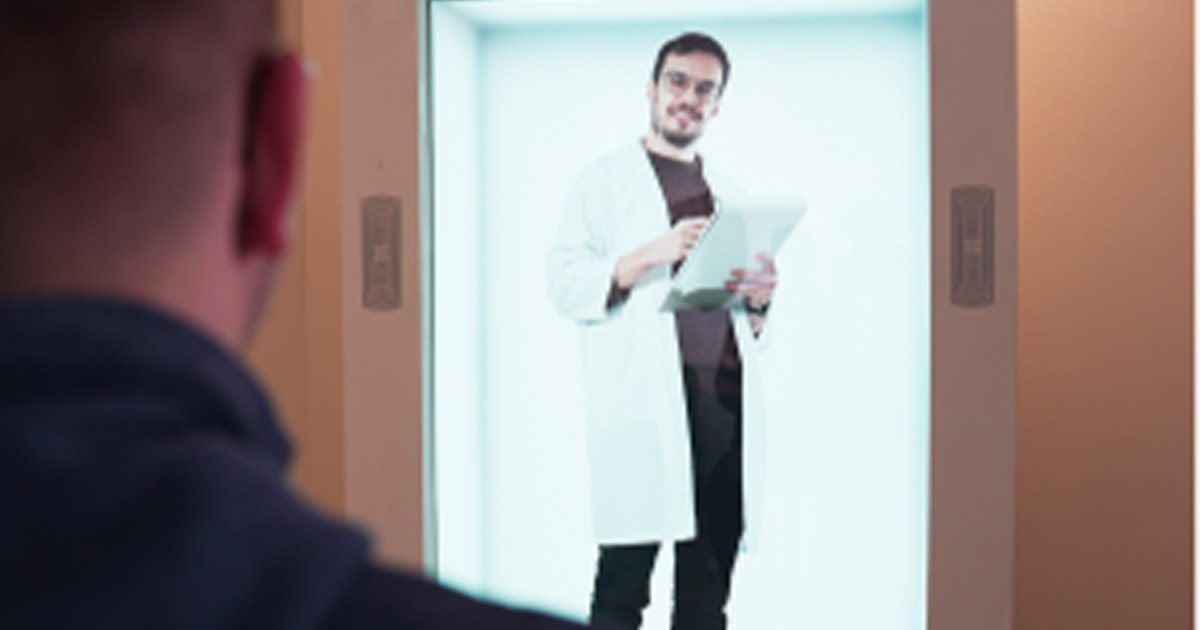 Male doctor appears in a 3D hologram display with a patient in the foreground