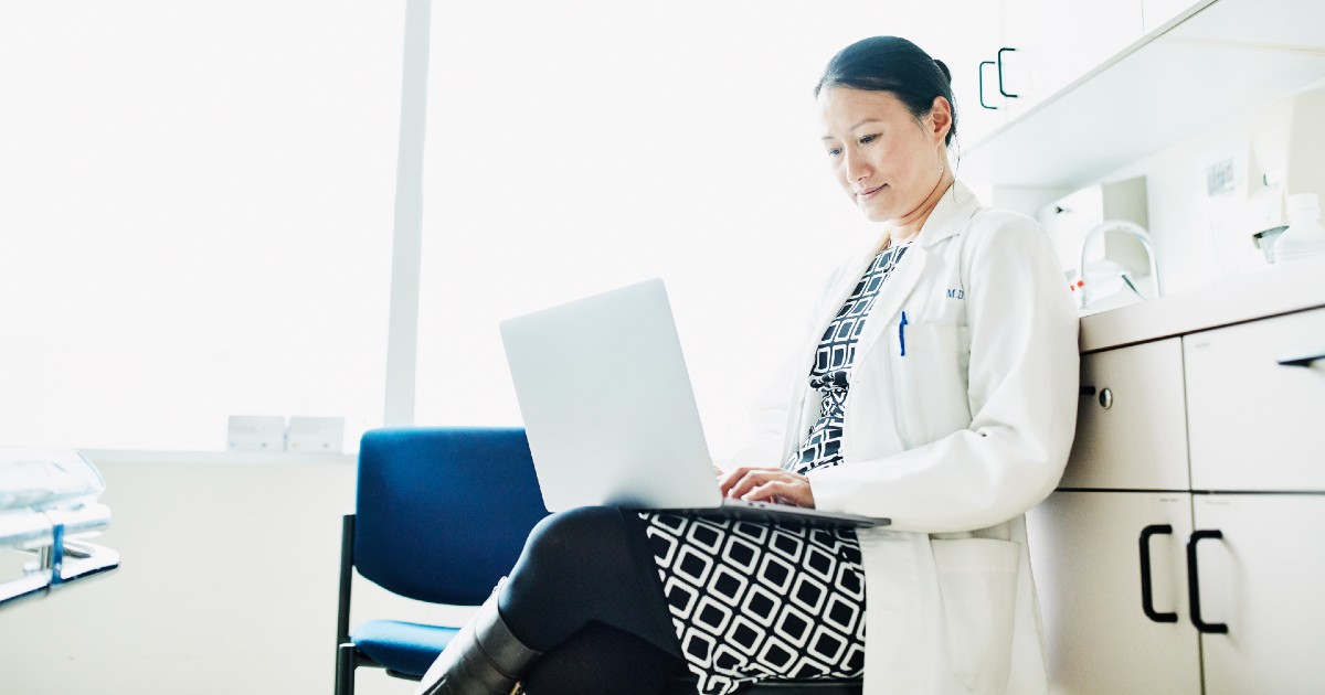 A doctor on their laptop