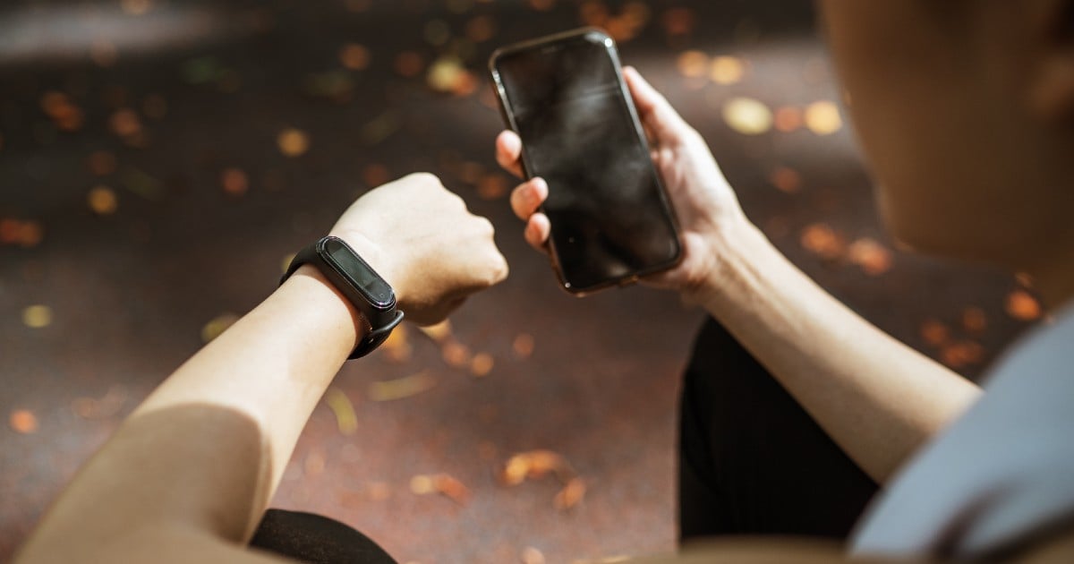 A person looking at their smart watch