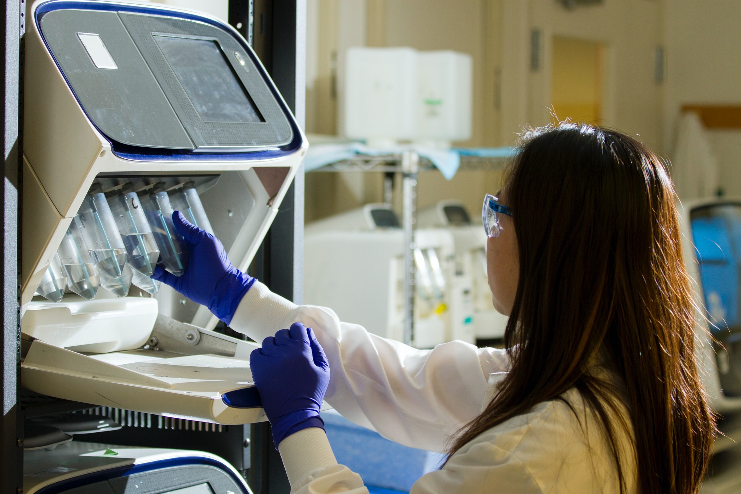 Medical professional holding a test tube.