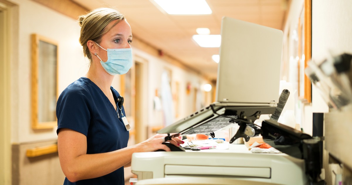 A nurse on a computer