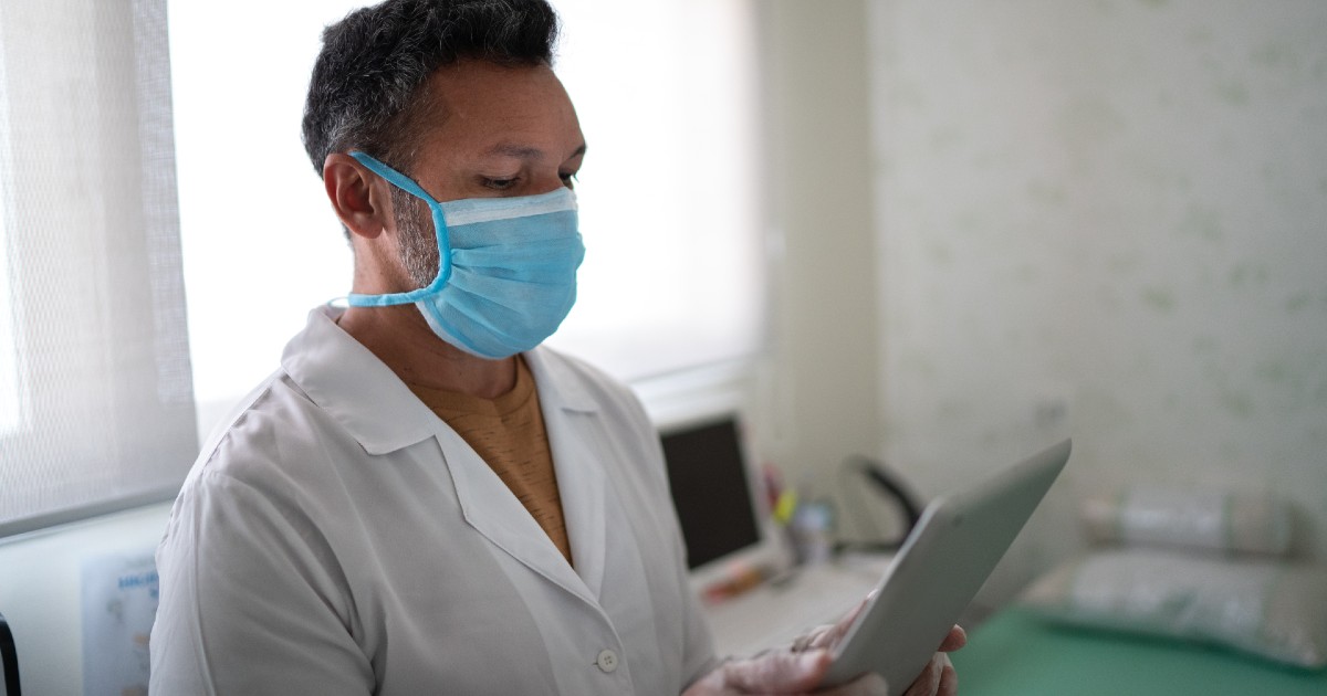 Health professional with tablet