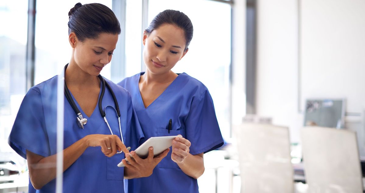 Nurses using a tablet