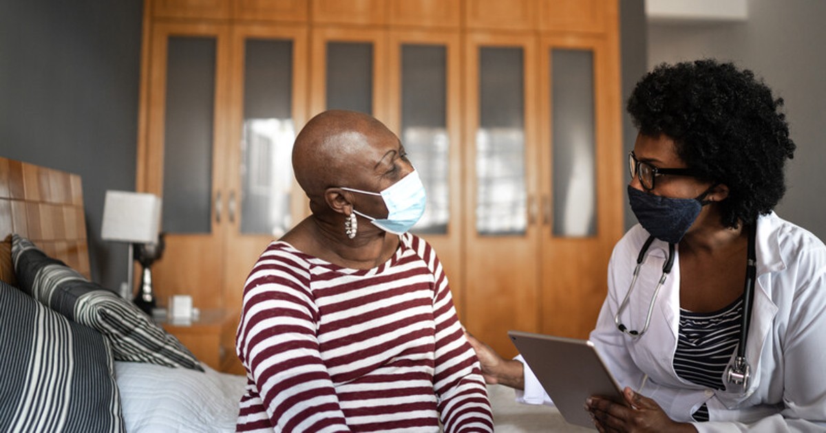 An older patient and a doctor
