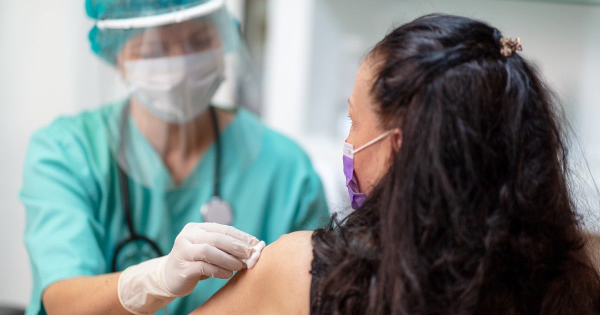 A person getting prepped to receive a vaccine