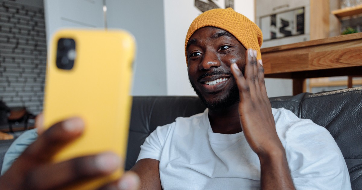 A person touching their face while on video chat