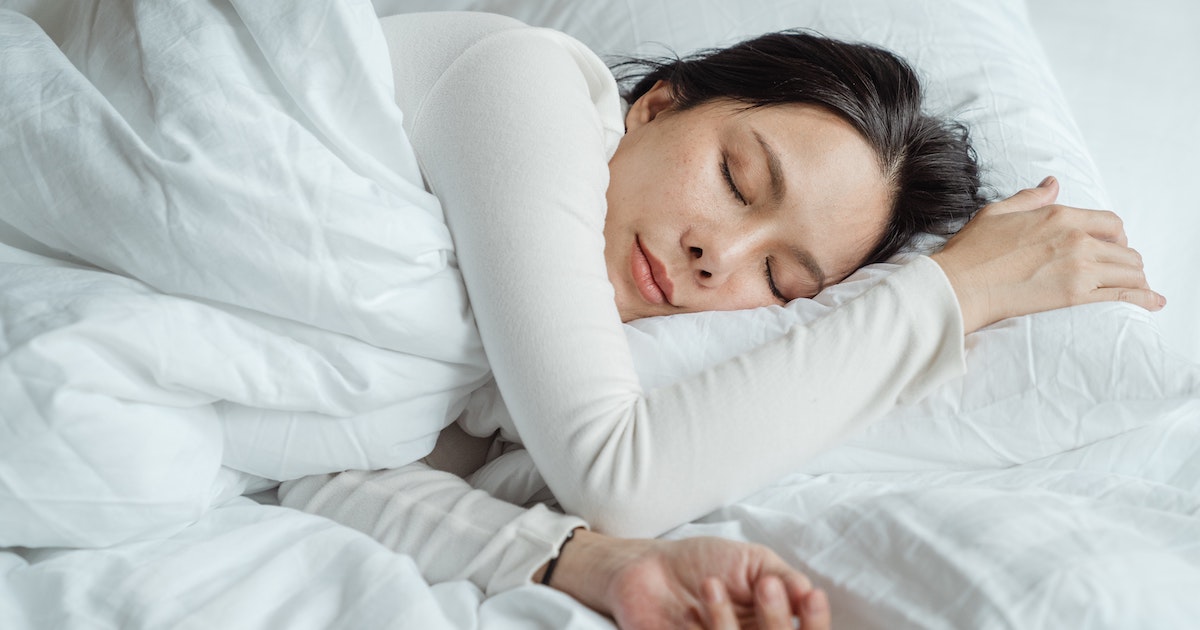 Person sleeping on side in bed
