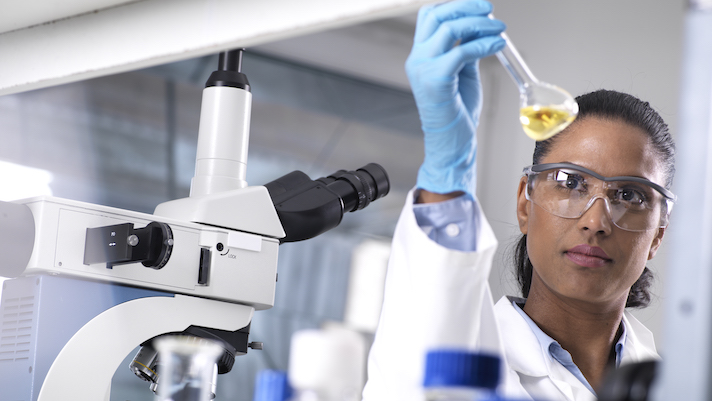 lab worker holding a test tube