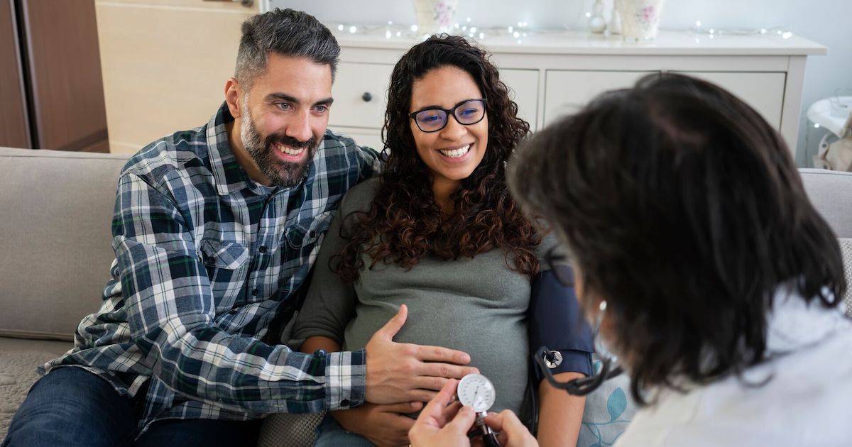 Doctor with pregnant couple