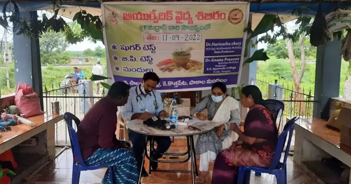 Two doctors providing in-person consultation to patients