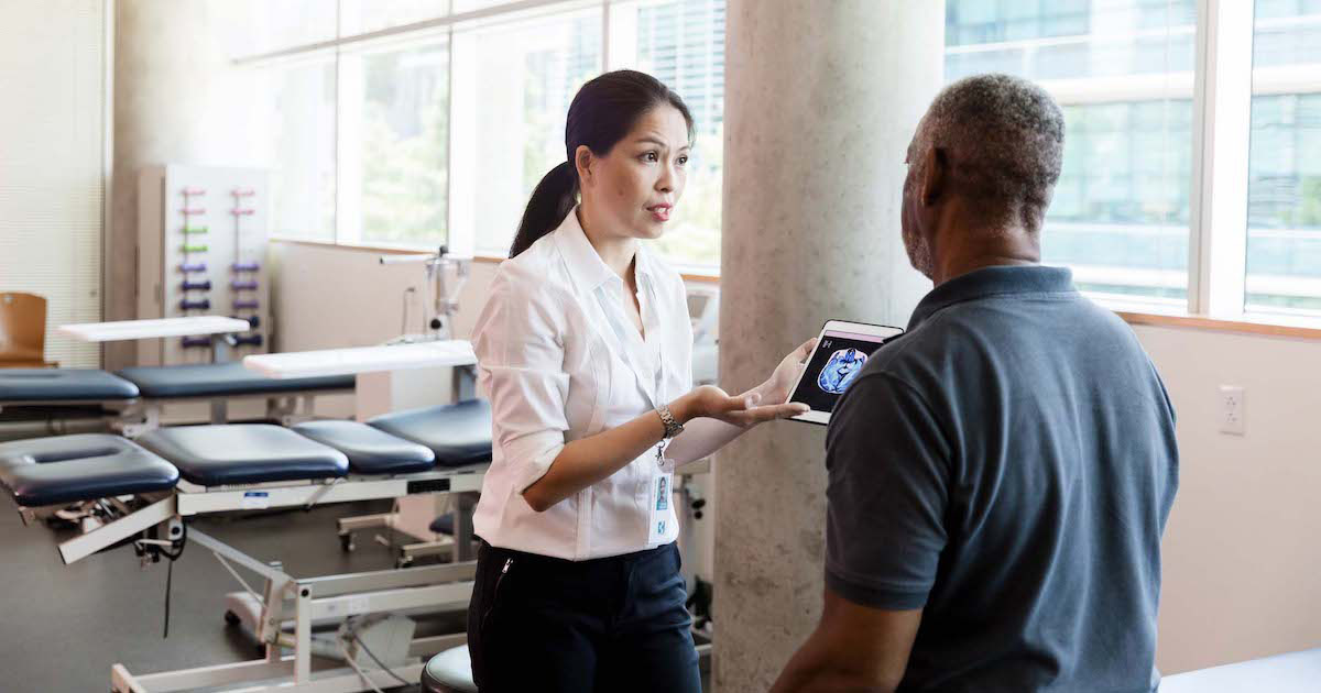 Client and worker at physical therapy center