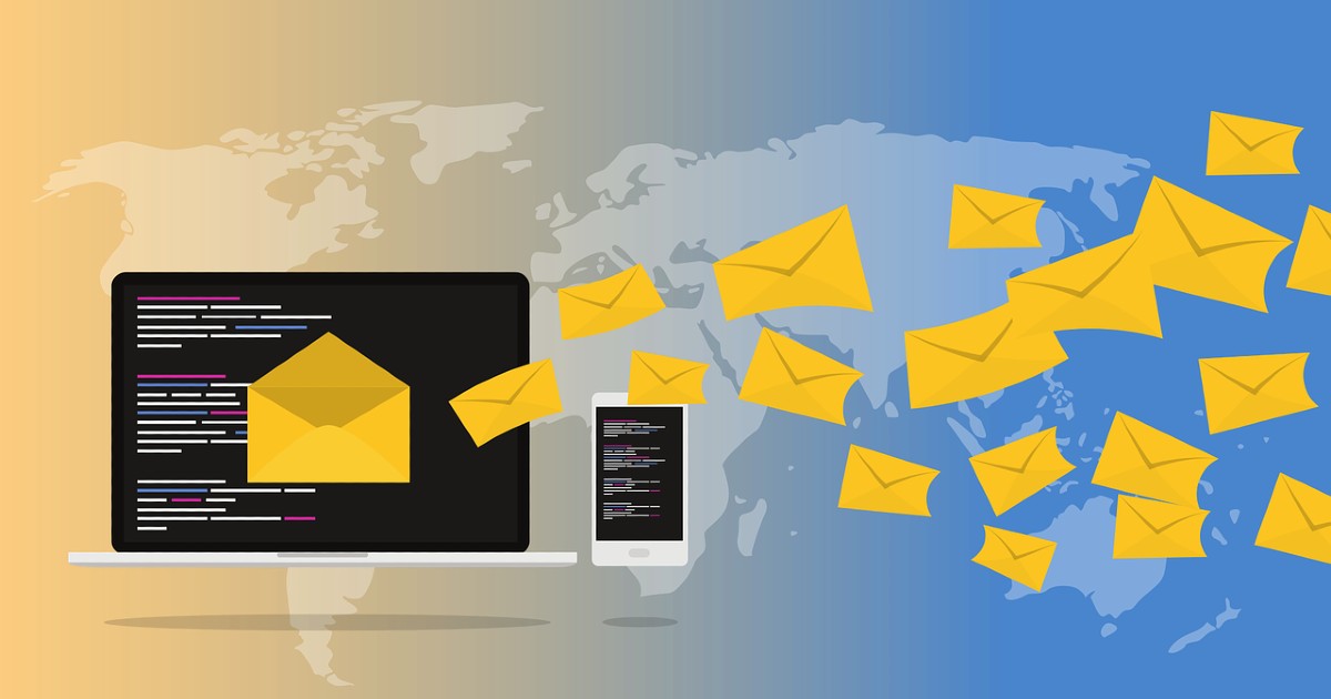 Email icons flying off a laptop