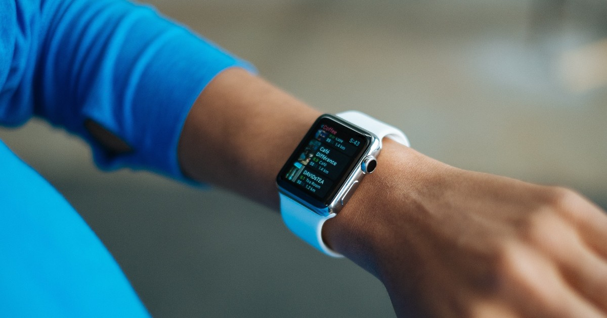 A wrist with a smartwatch on it