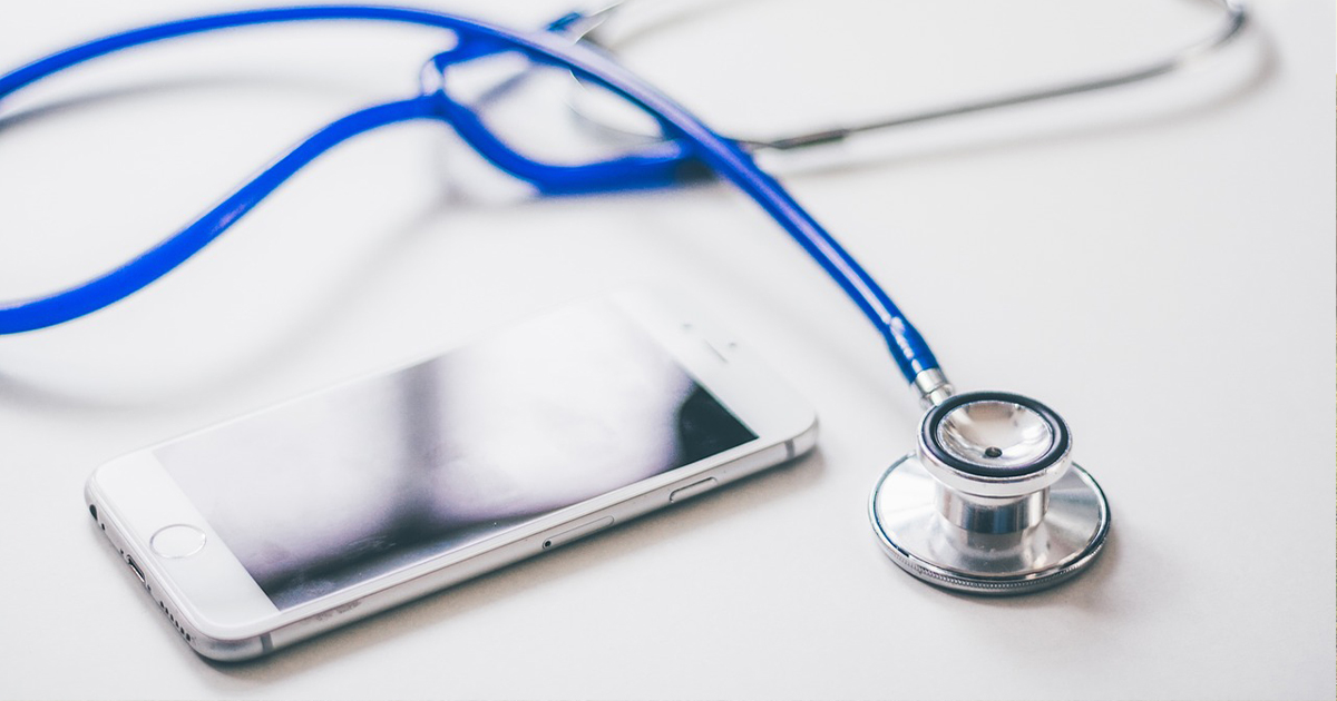 Stethescope and mobile phone on a table