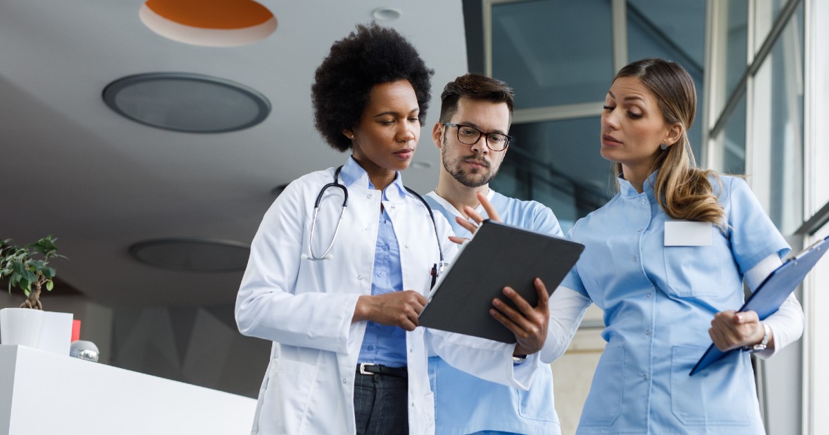 A team of professionals looks at an EHR