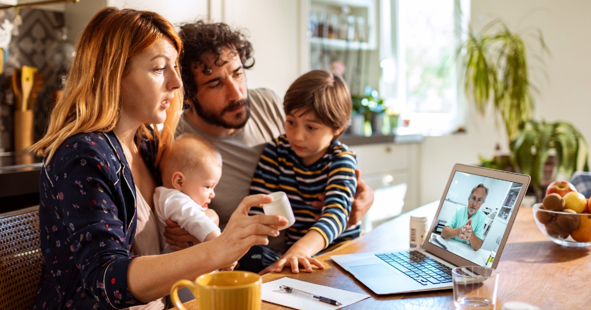 A family speaking to their doctor via videochat