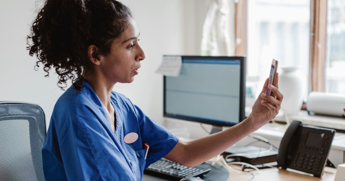 A provider speaking to a patient via telehealth