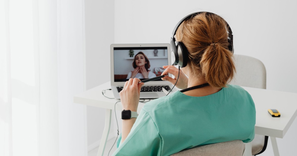 A clinician on a video call with a patient