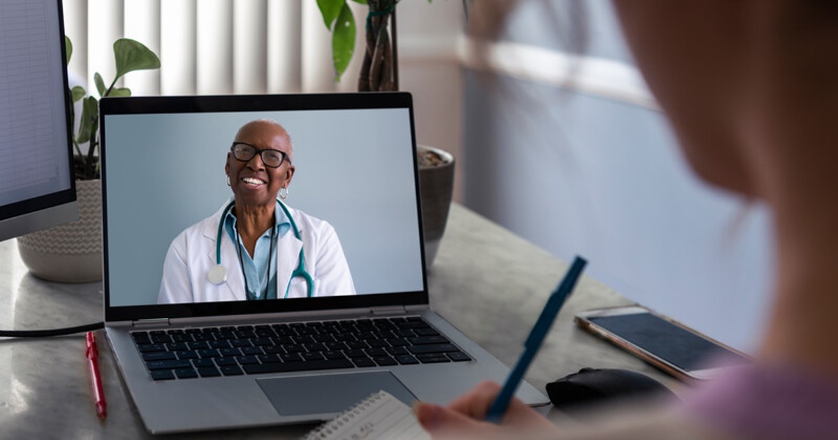 A doctor consulting with a patient via telehealth