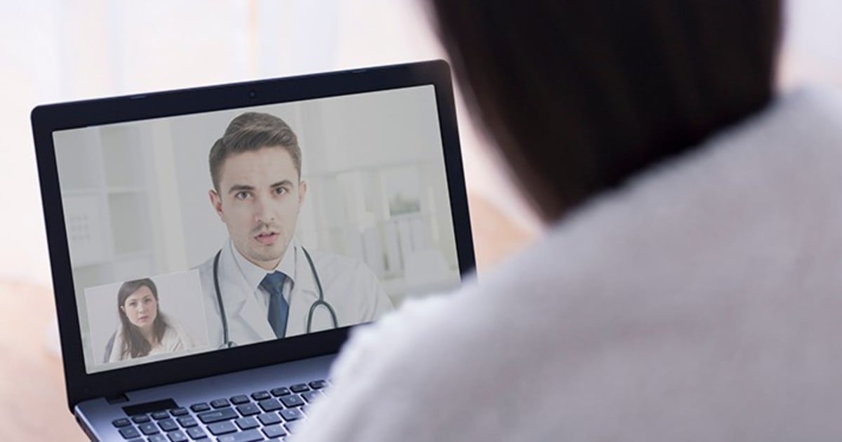 A person talking to a doctor on a computer screeen