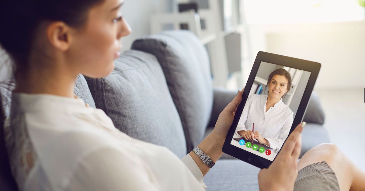 Patient attending telehealth appointment on tablet