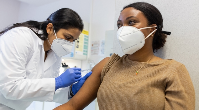 clinician giving patient a shot