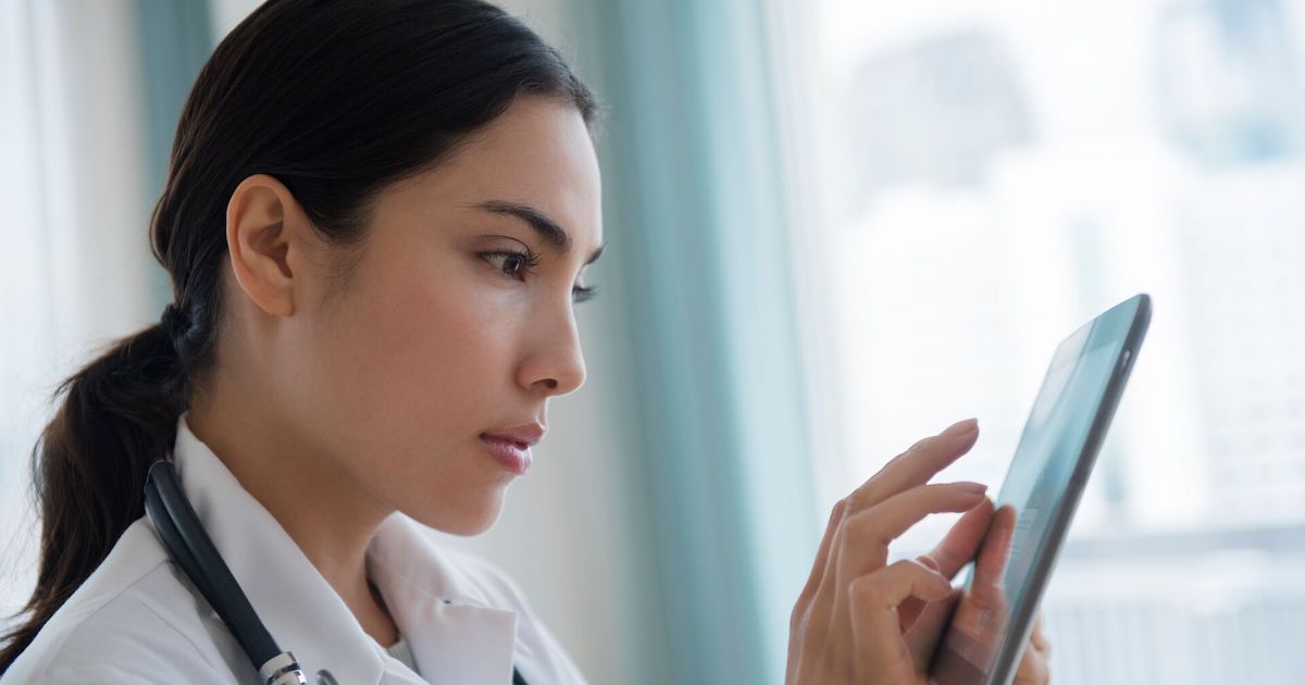 Healthcare worker using tablet