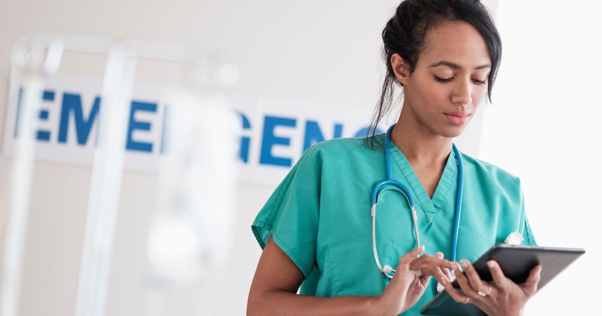 Healthcare worker using a tablet in a hospital