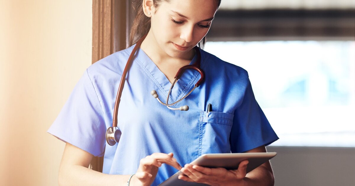 A clinician using a tablet