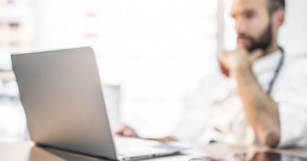 Doctor using laptop