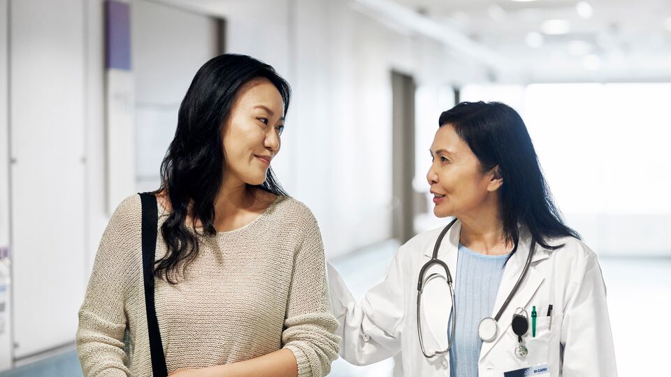 A doctor speaking with a patient.