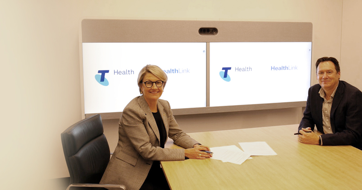 Telstra Health and HealthLink representatives following the signing of their sale deal
