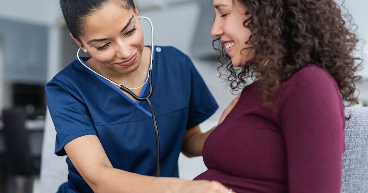A doctor checking up on a pregnant person