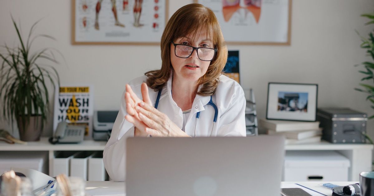 A doctor in a virtual call with a patient