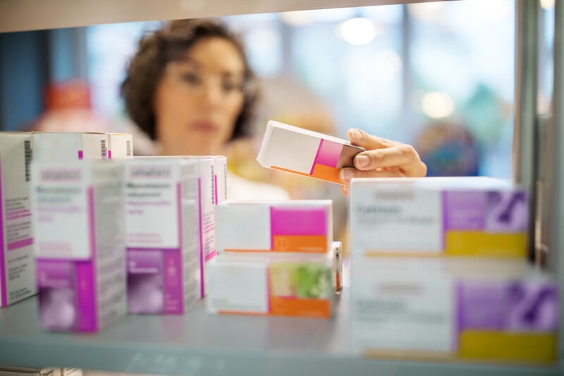 A pharmacist looking at medicine.