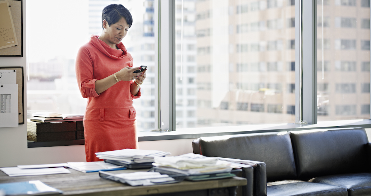 Office worker using smartphone