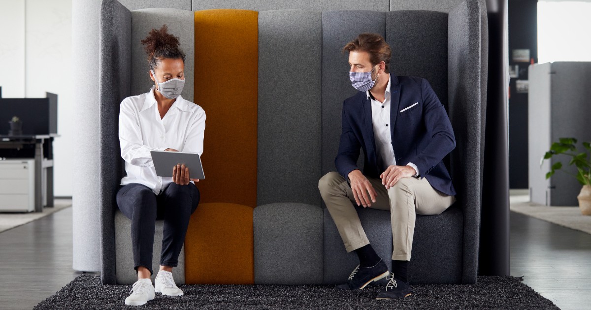 Two employees on a couch together