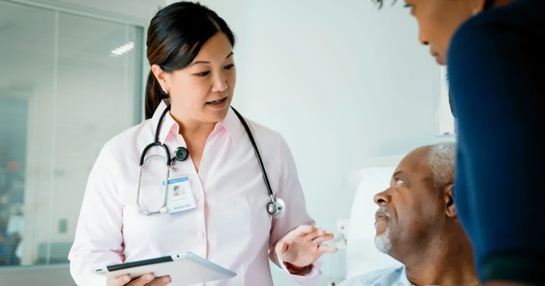 Doctor speaks to a patient in the hospital