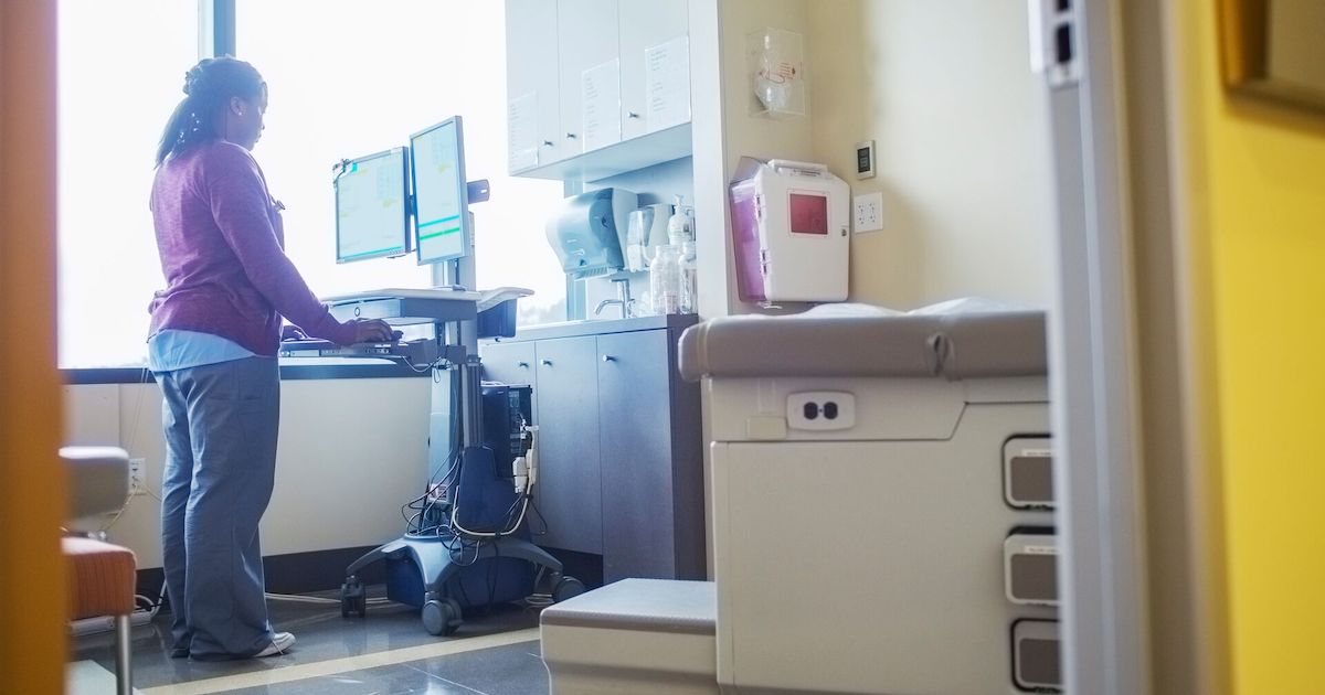 A nurse looking up a patient's record