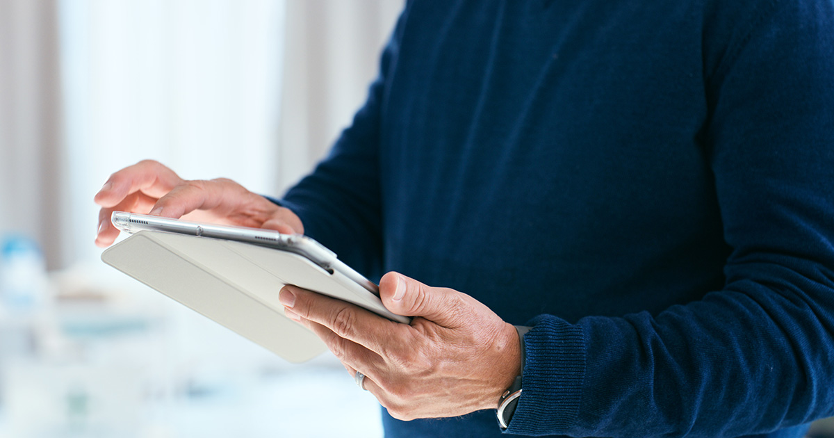 Patient looks at medical records on a tablet
