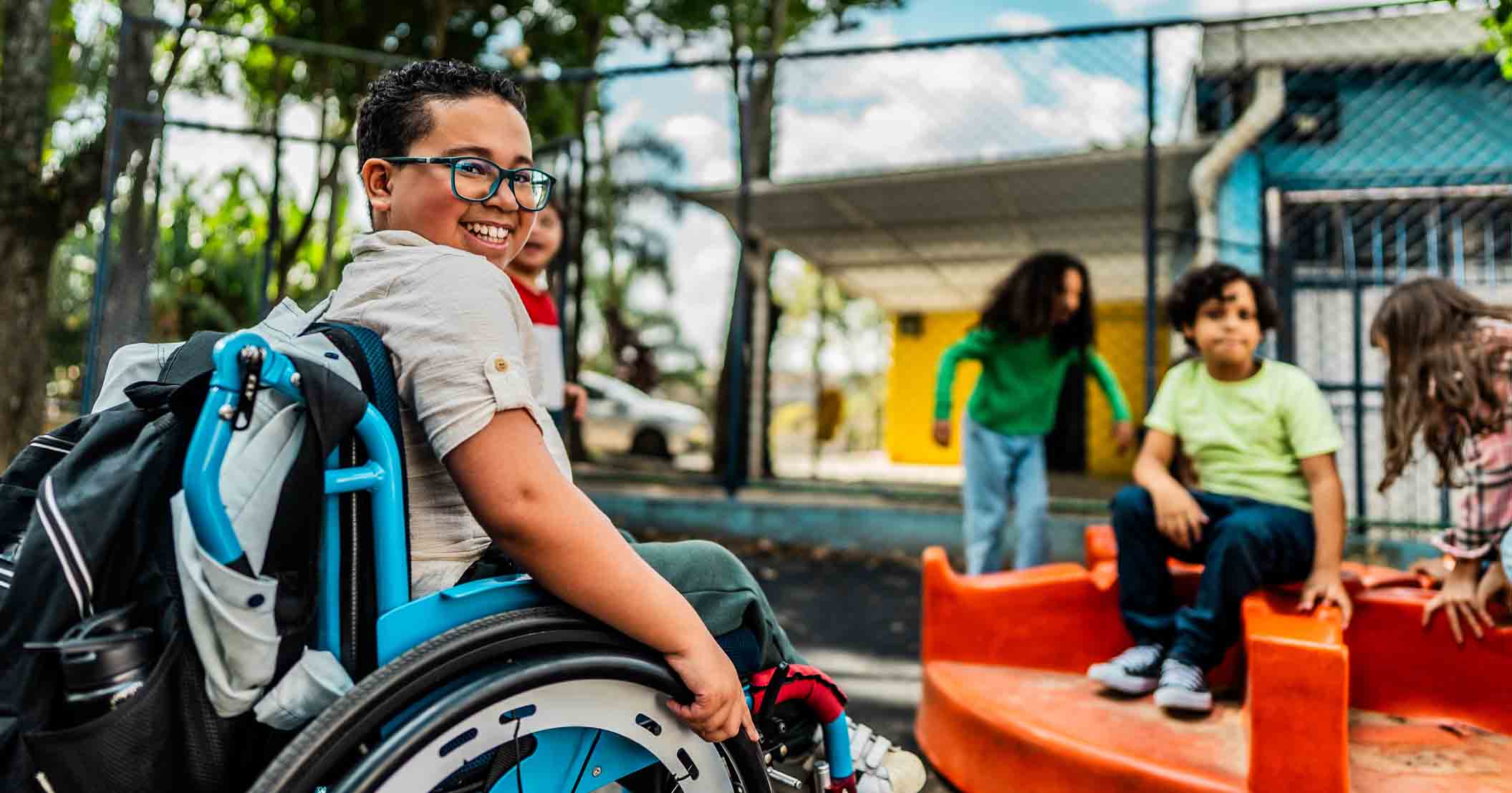 Student in a wheelchair on a playground
