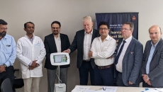 Officials from Manipal Hospitals and Isansys Lifecare pose during the signing of a partnership to adopt the Patient Status Engine