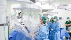 A surgeon operating a robotic-assisted surgery system 