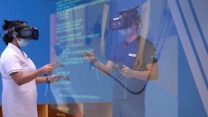 Medical students wearing XR headsets in a simulation training