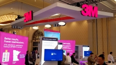 The 3M logo over a HIMSS booth