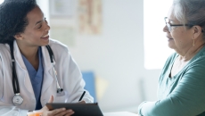 Doctor talking to patient