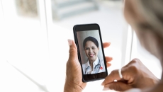 Person attending telehealth appointment on smartphone