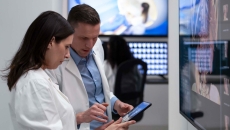 Healthcare workers looking at tablet